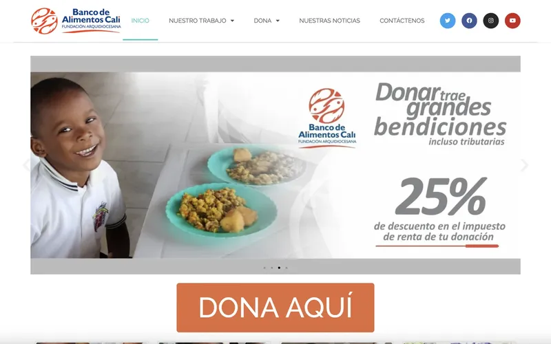 Banco de Alimentos Cali's website, showing a child with a plate of food and a donate button